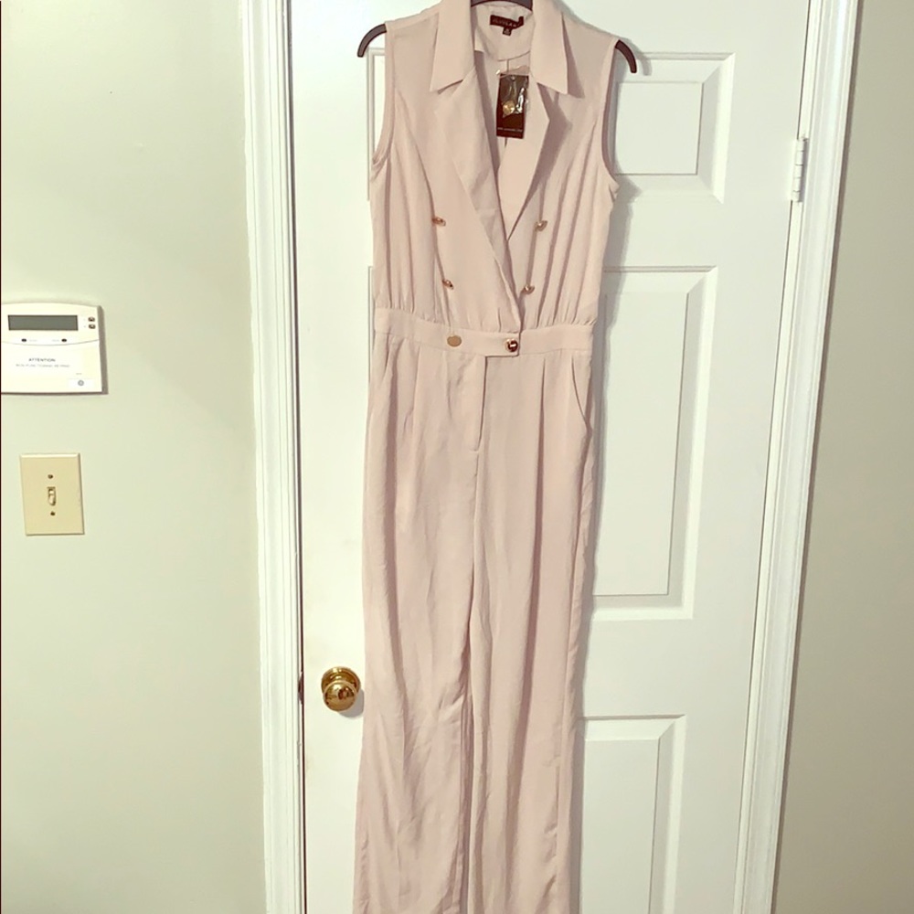Cream jumpsuit with gold buttons